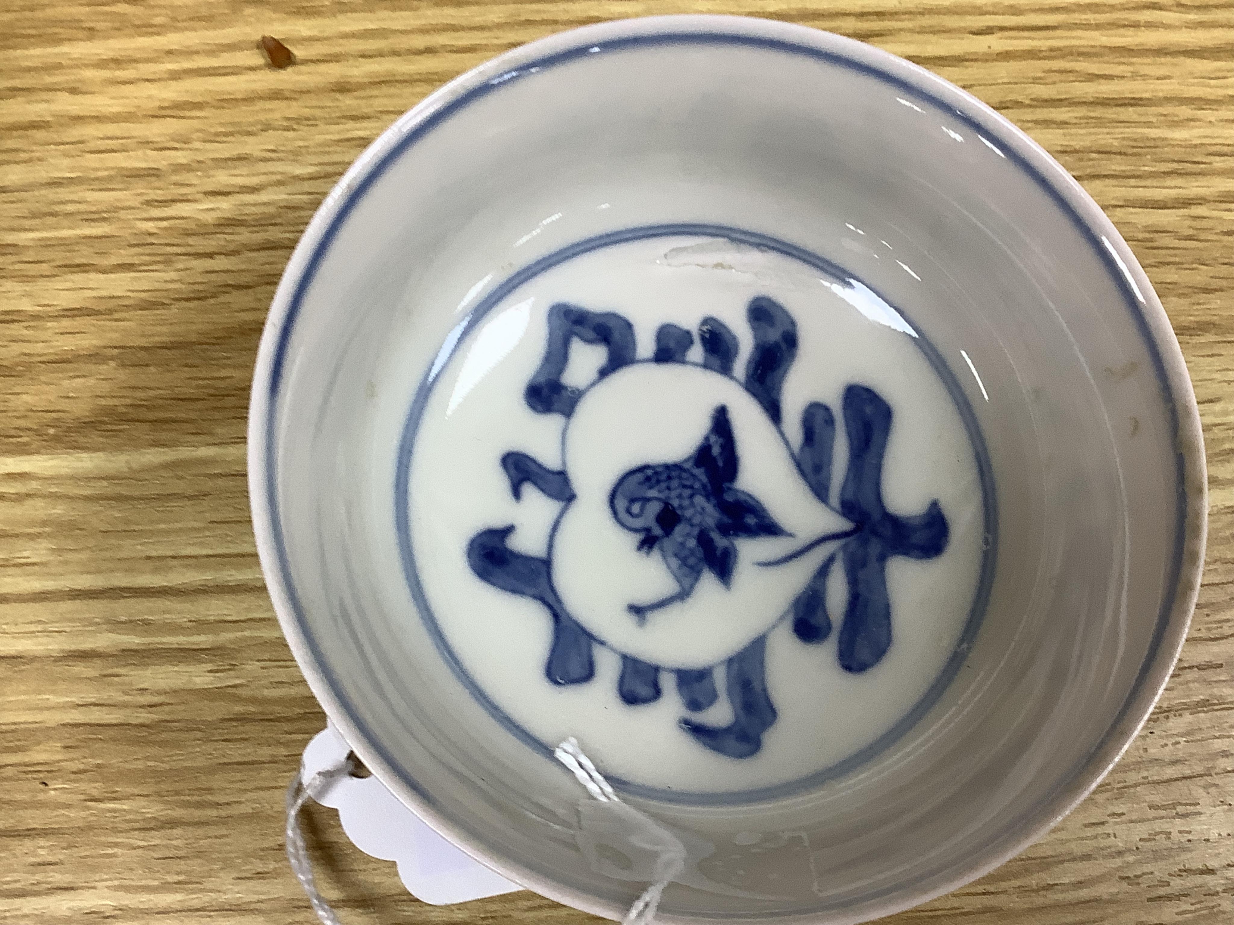 Two Chinese blue and white bowls and a lotus shaped tea pot stand, largest 15cm in diameter